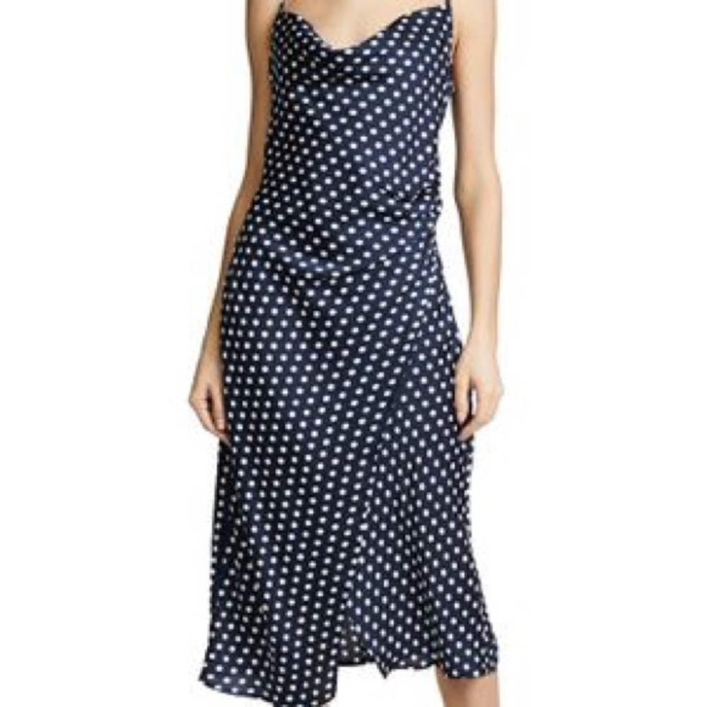 Navy blue satin dress with white polka dots.